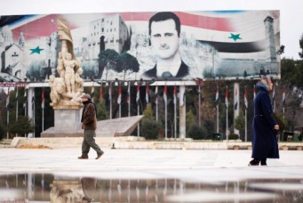 A billboard depicting Syria's President Bashar Al-Assad in the government controlled area of Aleppo, Syria, Dec. 17, 2016. Omar Sanadiki/Reuters