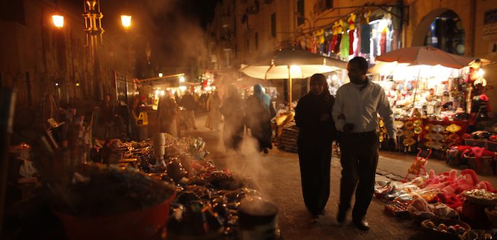 A couple strolls through a market, Cairo, Dec. 15, 2012. Khaled Abdullah/ Reuters